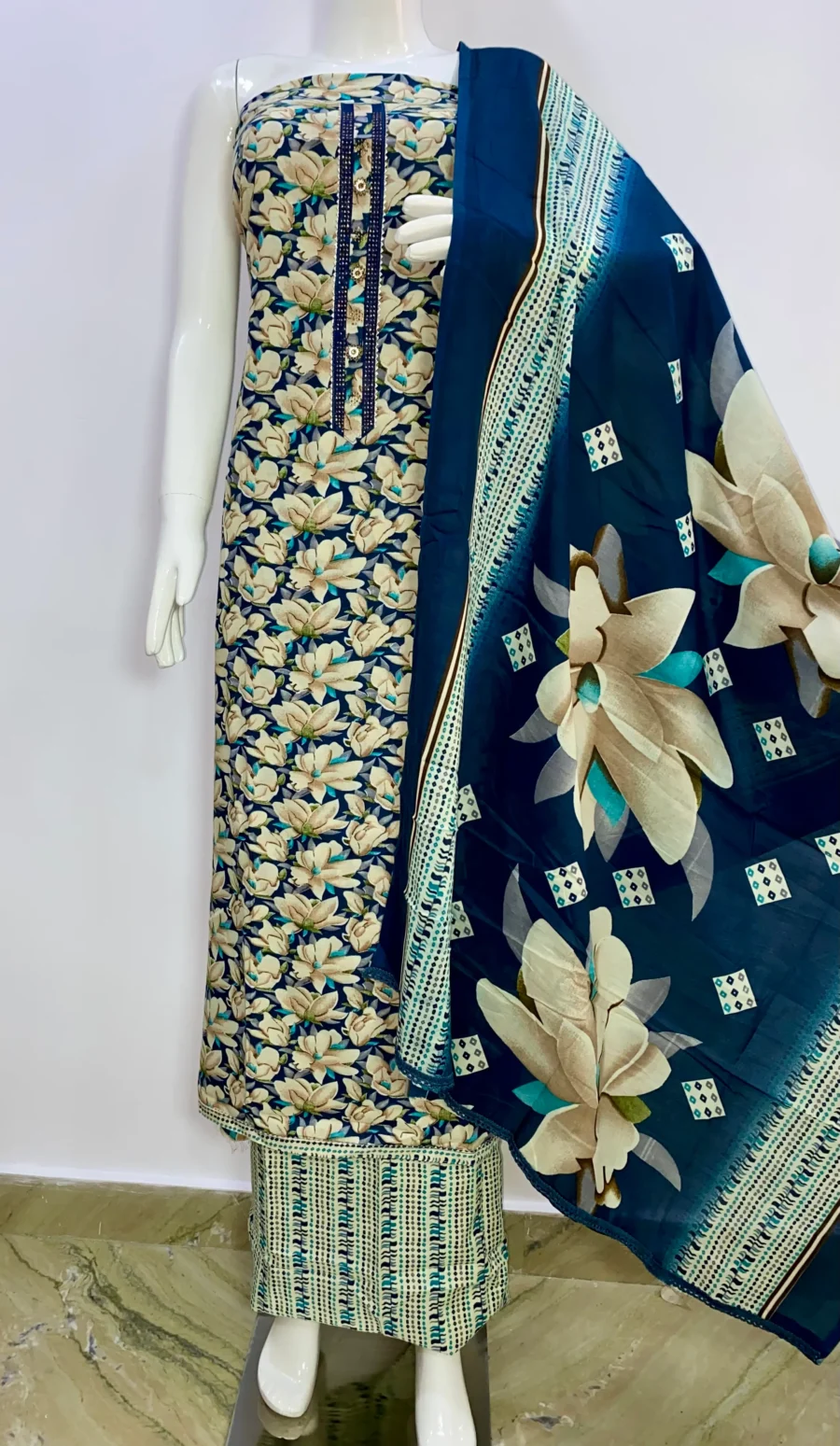 Unstitched cyan blue floral print cotton suit with printed muslin dupatta displayed on mannequin – ethnic wear by Sardarniz Fashion