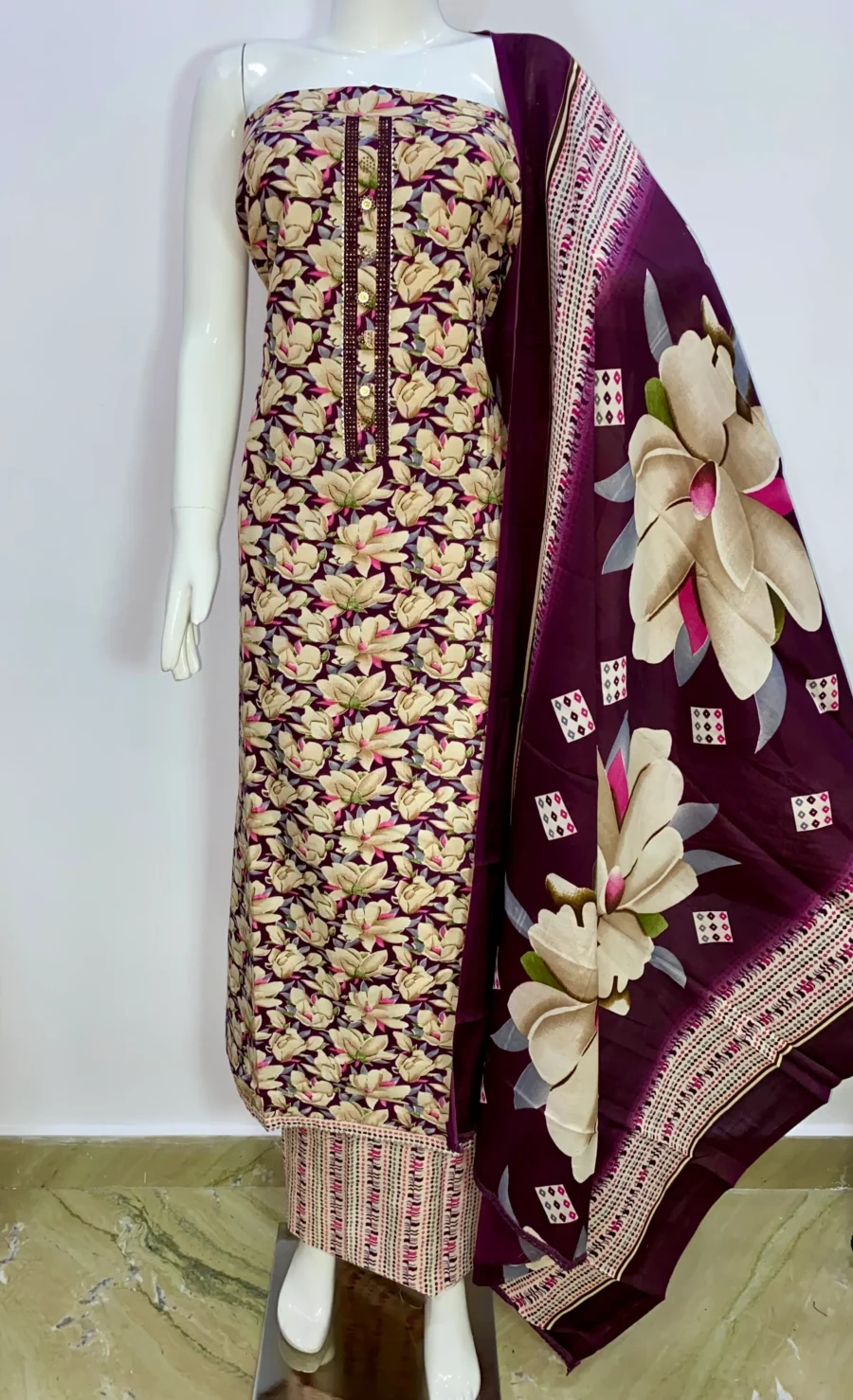 Unstitched dark purple floral print cotton suit with printed muslin dupatta displayed on mannequin – ethnic wear by Sardarniz Fashion
