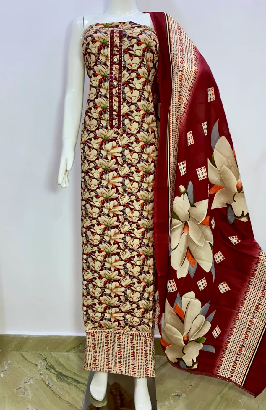 Unstitched dark red floral print cotton suit with printed muslin dupatta displayed on mannequin – ethnic wear by Sardarniz Fashion